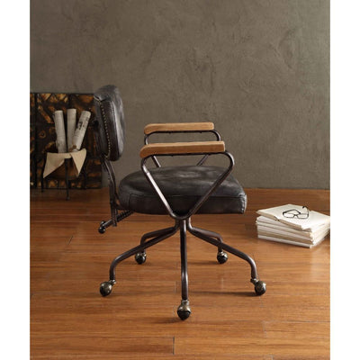 Our durable Hallie office chair gets its industrial look from oversized button tufted back and vintage top grain leather. The 5-star swivel base fitted with casters, it keeps you moving from one task to the next. Some Assembly Required.