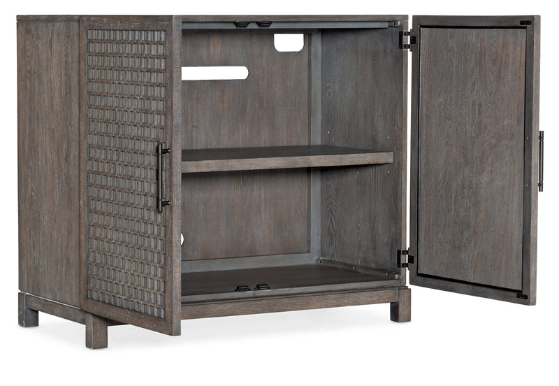 Hooker Furnishings Wooden 2-Door Chest with medium wood finish, featuring lattice-style doors partially open to reveal internal shelving. This chest stands on short, sturdy legs and appears modern in design.
