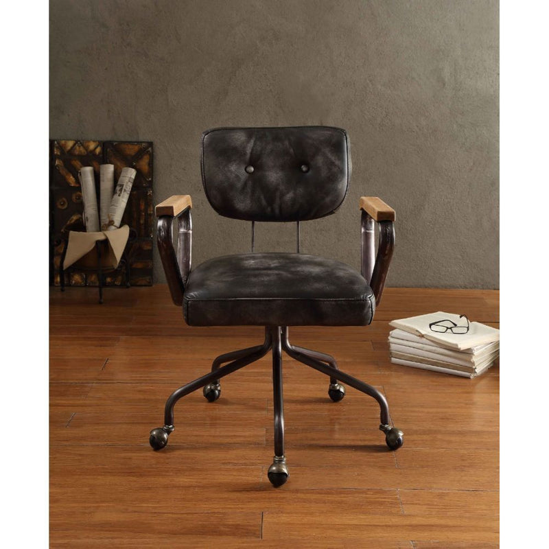 Our durable Hallie office chair gets its industrial look from oversized button tufted back and vintage top grain leather. The 5-star swivel base fitted with casters, it keeps you moving from one task to the next. Some Assembly Required.