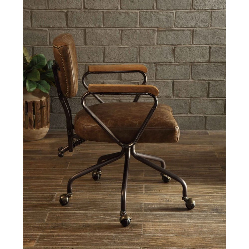 Our durable Hallie office chair gets its industrial look from oversized button tufted back and vintage top grain leather. The 5-star swivel base fitted with casters, it keeps you moving from one task to the next. Some Assembly Required.