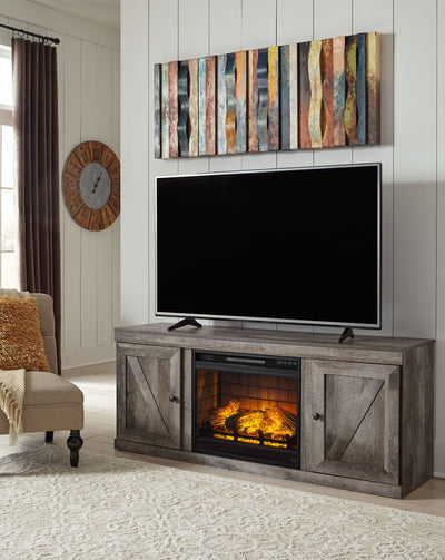 Wynnlow - Gray - TV Stand With Faux Firebrick Fireplace Insert.